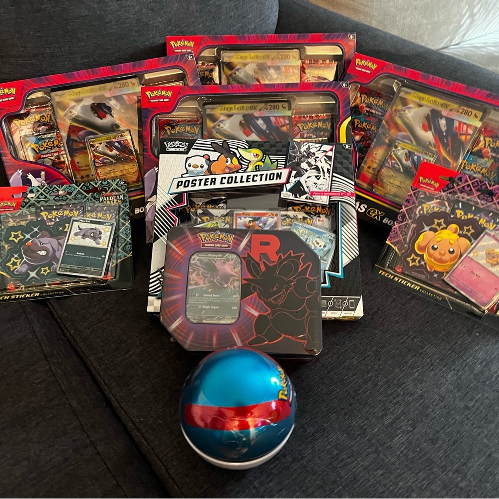 Pokemon Card and Tin Collection with Red and Blue Accents